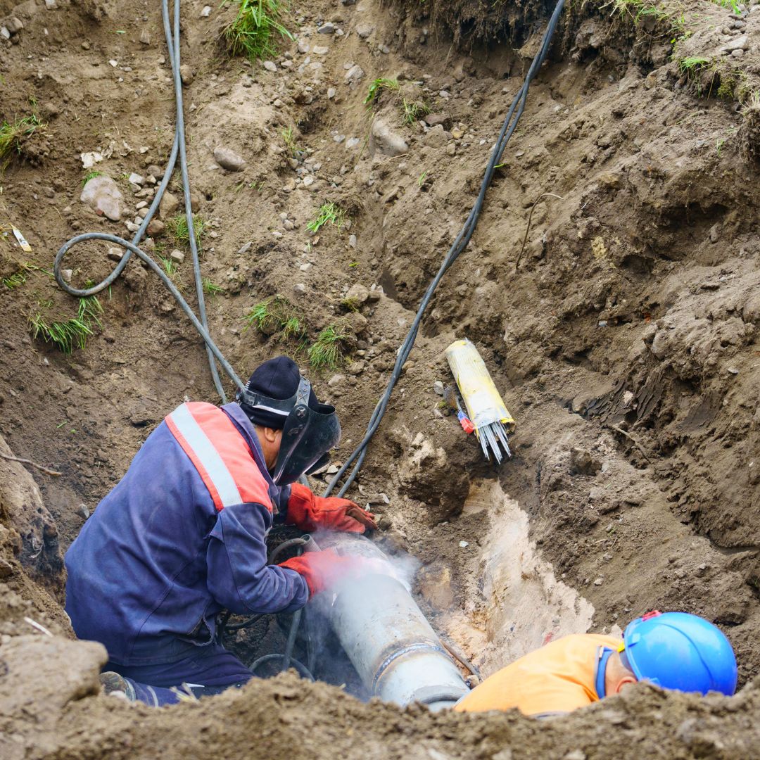 underground pipe contractors working with utility lines
